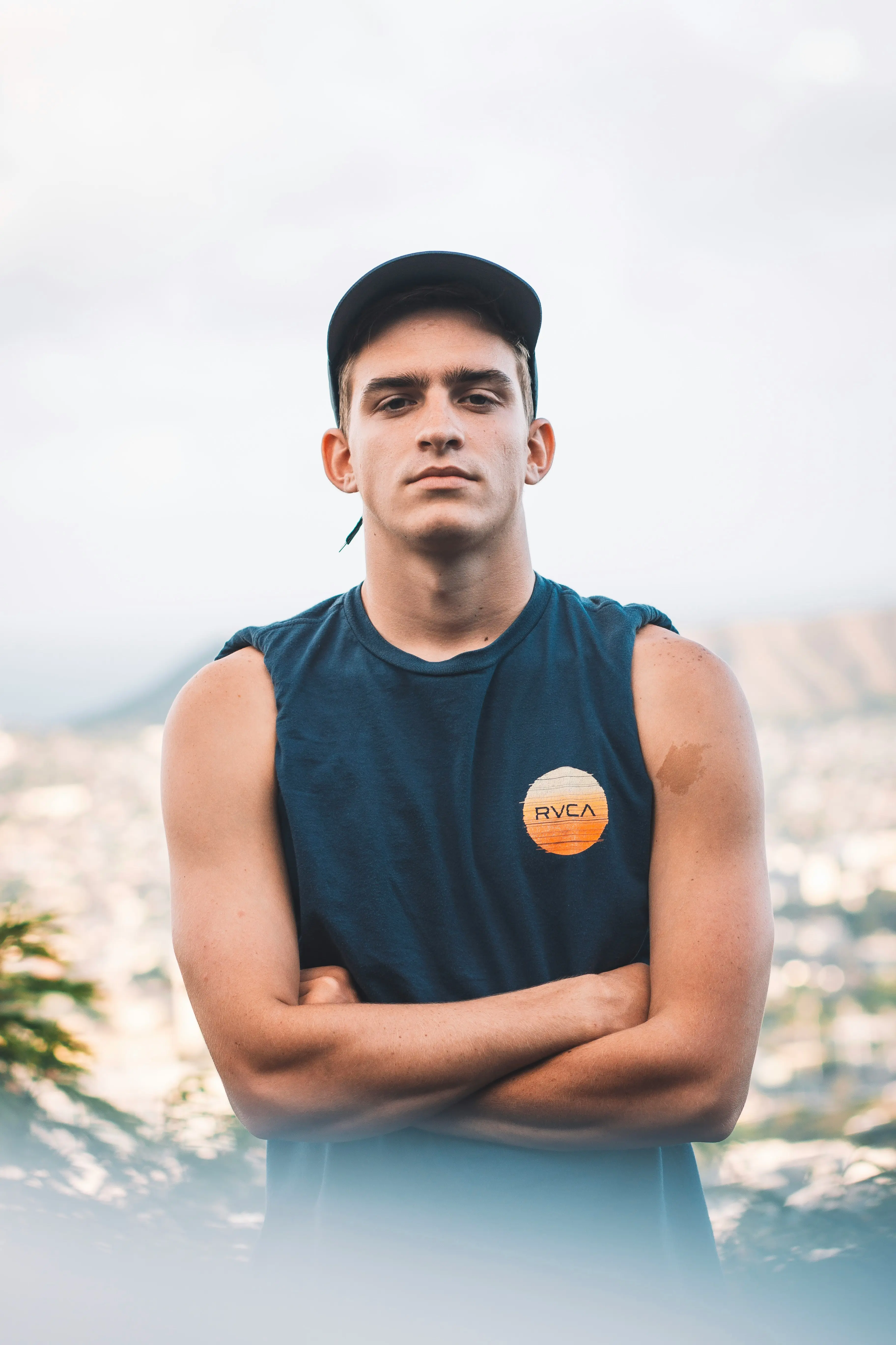 man standing with his arms crossed