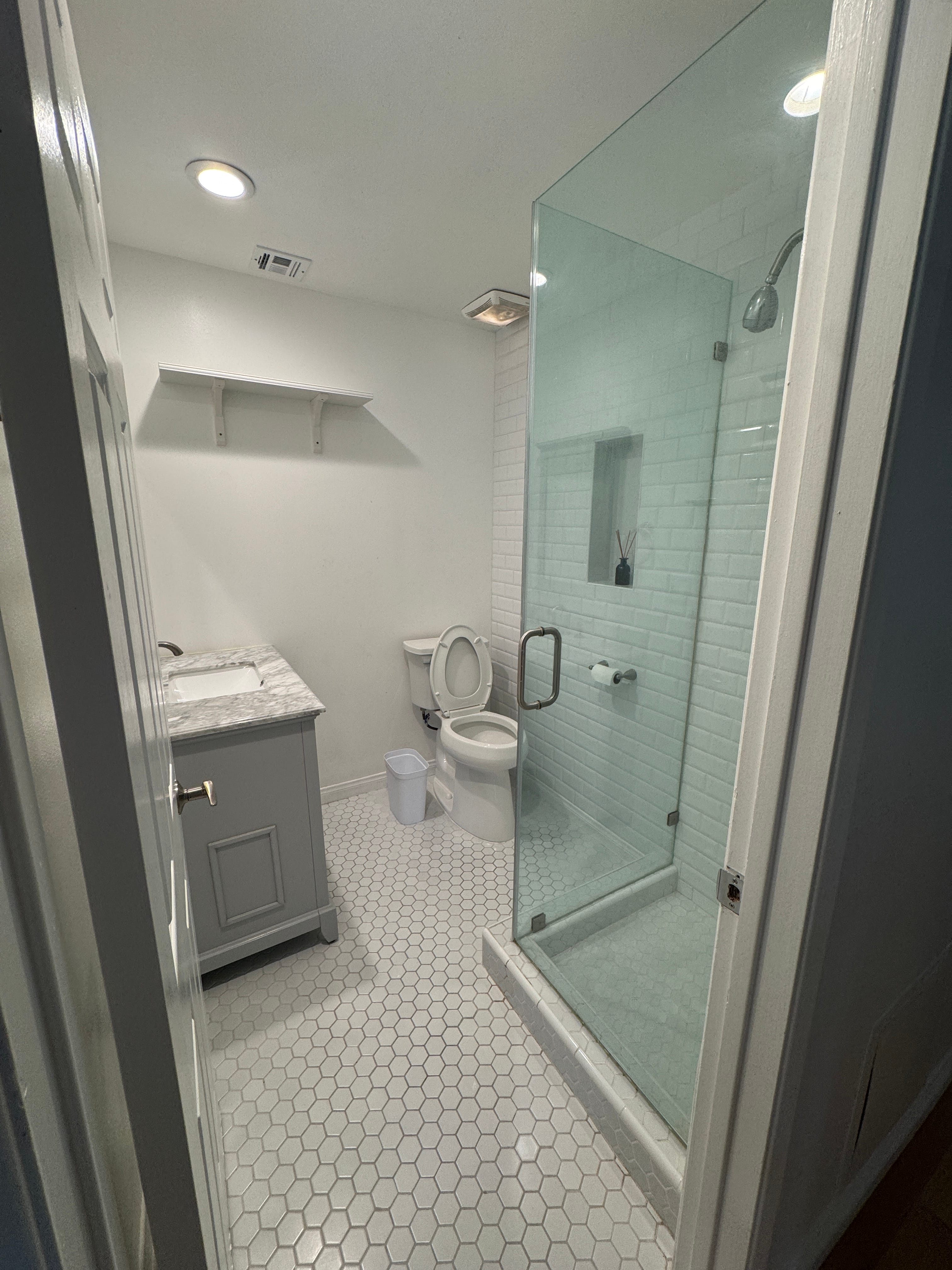 interior of a bathroom with a gold shower